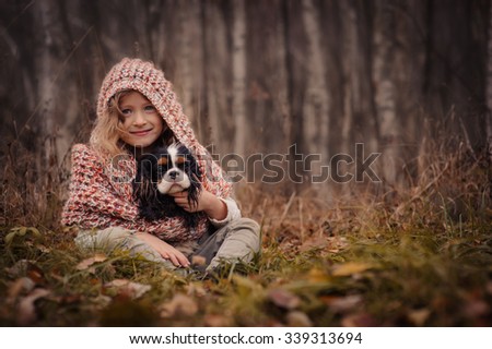 Similar – Foto Bild fröhliches Kind Mädchen mit einem Korb voller Äpfel, das mit ihrem Hund spielt.