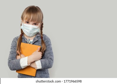 Happy child girl wearing medical protective face mask on white background - Powered by Shutterstock