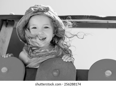 Happy Child Having Fun On The Playground ( Black And White )