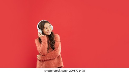 Happy Child Listen Music In Headphones. Kid Wear Sweater. Express Positive Emotion.