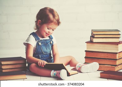 happy child little girl with a books - Shutterstock ID 374083204