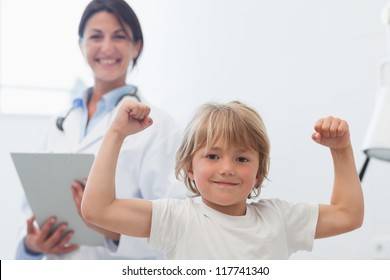 Happy Child Next To A Doctor In Hospital Ward
