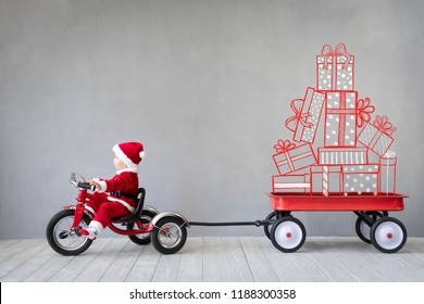 Happy Child Paying At Home. Kid Having Fun On Christmas Time. Xmas Holiday Concept