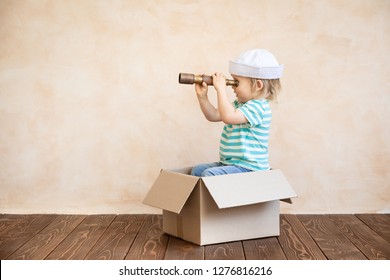 Happy Child Pretend To Be Sailor. Funny Kid Playing At Home. Summer Vacation And Travel Concept