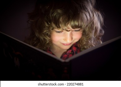 Happy Child Reading Magic Book