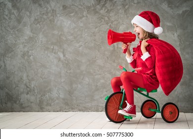 Happy Child Rides A Retro Bike. Kid Playing At Home. Christmas Xmas Winter Holiday Concept