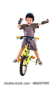 Happy Child Riding His New Bike On White Studio Background