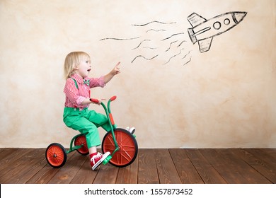 kid on tricycle