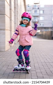 happy child rollerblading. active children sport concept. rollerblader kid. girl on roller skating