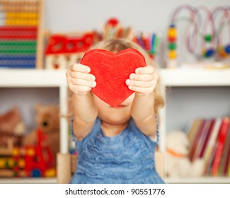 Happy Child With Small Handmade Paper Red Heart In Class. Valentine`s Day Concept