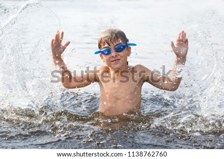 Similar – photo of an adorable boy learning to swim