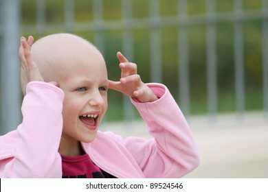 Happy Child Who Lost Her Hair Due To Chemotherapy To Cure Cancer