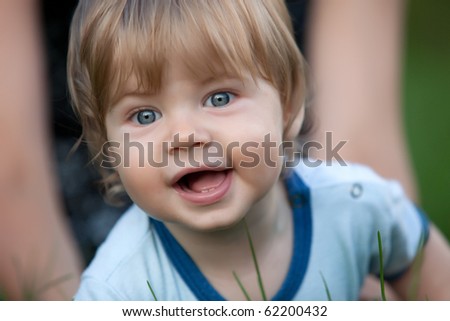 Similar – Image, Stock Photo Little cute boy looking at camera and sticking out his tongue