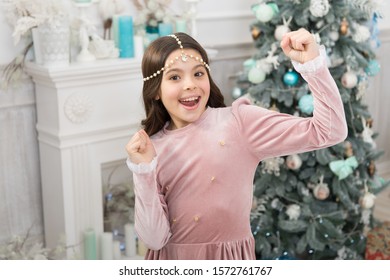 Happy Childhood. Waiting Christmas. Glamorous Girl Celebrate Christmas. Host Amazing Christmas Party At Home. Child Enjoy Winter Holidays. Winter Vacation. Fancy Girl In Luxury Decorated Interior.