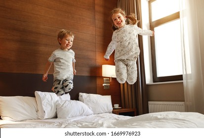 happy children brother and sister jump on bed in the bedroom
 - Powered by Shutterstock