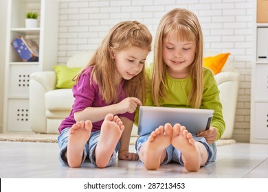 Happy Children Holding Digital Tablet