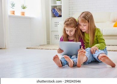 Happy Children Holding Digital Tablet