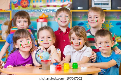 Happy Children In Language Camp Studying Geography