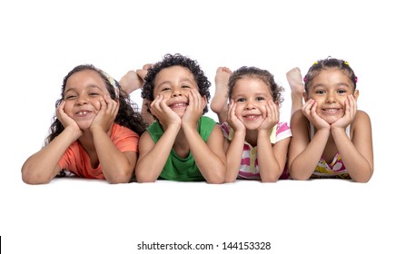 Happy Children Laying On The Floor Posing For Photo