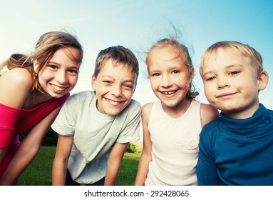 Happy Children Outdoors. Friends At Summer