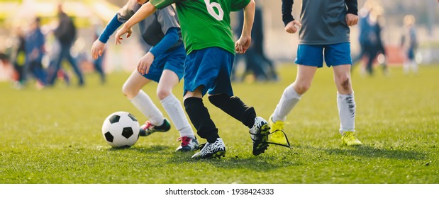 Happy Children Playing Football League. Boys in Soccer Academy Compete in Tournament Game on a Summer Sunny Day. Kids Kicking European Football Match