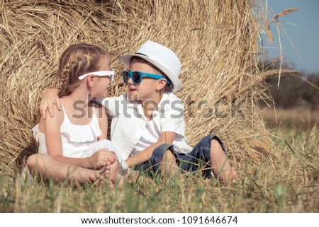 Similar – Vater und Sohn sitzen im Park.