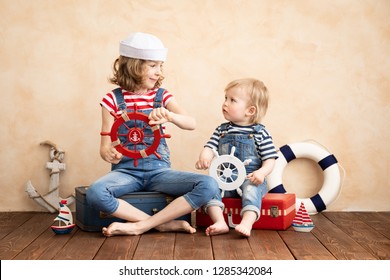 Happy Children Pretend To Be Sailor. Funny Kids Playing At Home. Summer Vacation And Travel Concept