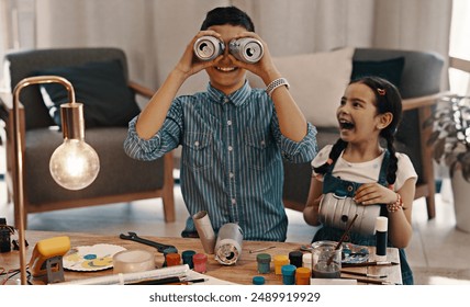 Happy children, siblings and playing with equipment for science project, arts and crafts at home. Excited kids, sister and playful brother with recycling material on experiment or assignment at house - Powered by Shutterstock