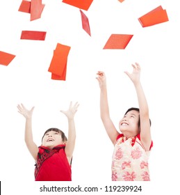 Happy Chinese New Year.two Asian Kids Trying To Catch Red Envelope For Good Luck And Rich