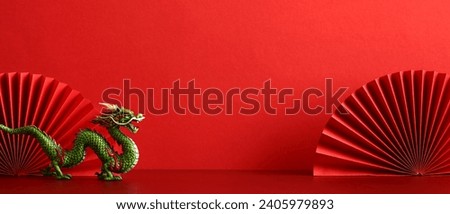 Happy Chinese New Year banner template. Red paper fans with dragon on red background. Traditional holiday Lunar New Year. Happy New Year of the Dragon.