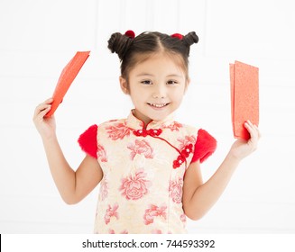 Happy Chinese New Year. Little Girls Holding Red Envelope
