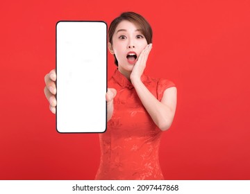 Happy Chinese New Year. Suprised Young Woman Showing Blank Smart Phone Screen