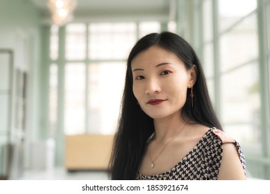 A Happy Chinese Woman Inside A Sitting Room Within The Walters Art Museum In Baltimore Maryland.