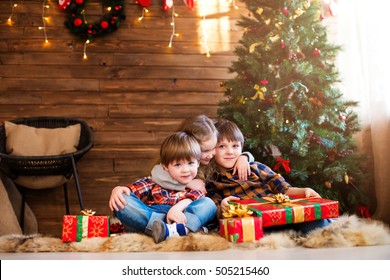 Happy Christmas - Kids With Christmas Gift. Christmas Decorations In The House.