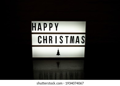 Happy christmas lightbox with dark background - Powered by Shutterstock