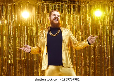 Happy chubby guy having fun at concert or disco party. Rich young man in shiny jacket and gold chain necklace singing and dancing on nightclub stage with glittering foil fringe curtain background - Powered by Shutterstock