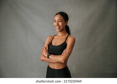 Happy Close Up Of Multiethnic Female Standing With Folded Arms