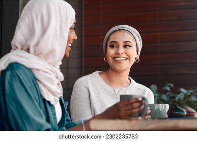 Happy, coffee and smile with Muslim women in cafe for conversation, food and social. Friends, relax and culture with arabic female customer in restaurant for discussion, happiness and meeting - Powered by Shutterstock