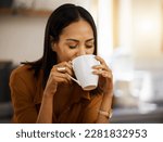 Happy, coffee and woman at home in a kitchen with a hot drink feeling relax and calm in the morning. Happiness, zen and young female drinking in a house holding a mug in a household with mockup