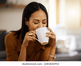 Happy, coffee and woman at home in a kitchen with a hot drink feeling relax and calm in the morning. Happiness, zen and young female drinking in a house holding a mug in a household with mockup