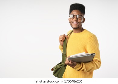 Happy College Student In Eyeglasses With Backpack Holding Laptop Isolated On White Background