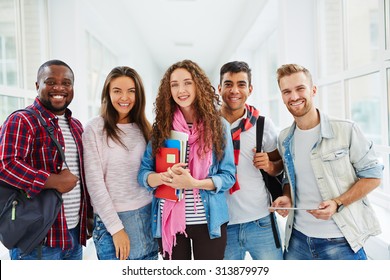 Happy College Students Looking At Camera With Smiles