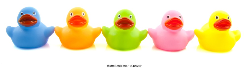 Happy Colorful Rubber Ducks In A Row Isolated Over White