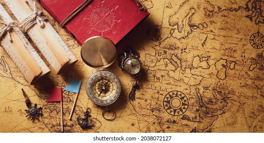 Happy Columbus Day concept. Vintage compass and treasure manuscript.  Flat lay, top view with copy space.
