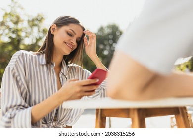 Happy Communication. One Smiling Beautiful Girl Texting On Phone On Summer Cafe Terrace. Sunny Summer Day Out. Concept Of Communication, Happiness, Ad