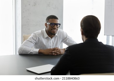 Happy confident African business leader meeting with employee, partner, discussing project. Employer interviewing job candidate. Client consulting lawyer, financial broker, banker for advice - Shutterstock ID 2118840863