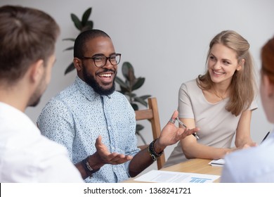 Happy Confident African Male Business Coach Leading Diverse Team Meeting Seminar Speaking About Good Work Result Motivate Employees, Black Mentor Talking To Office Workers Group At Workshop Training