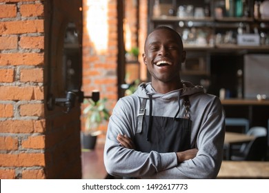 Happy Confident African Waiter Small Business Owner Portrait, Positive Black Male Entrepreneur Looking At Camera Laughing Standing In Restaurant, Cheerful Businessman Wear Apron Posing In Coffeeshop