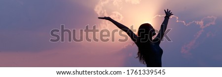 Happy confident Asian woman raising her hands up relax on summer vacation time, carefree girl being in nature, freedom people concept.