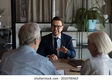 Happy confident lawyer, realtor, notary, financial advisor giving consultation, legal advice to senior couple of clients about medical insurance, wills, house buying or selling, savings, investment